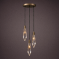 Three crystal drops at staggered heights from a round bronze spreader plate