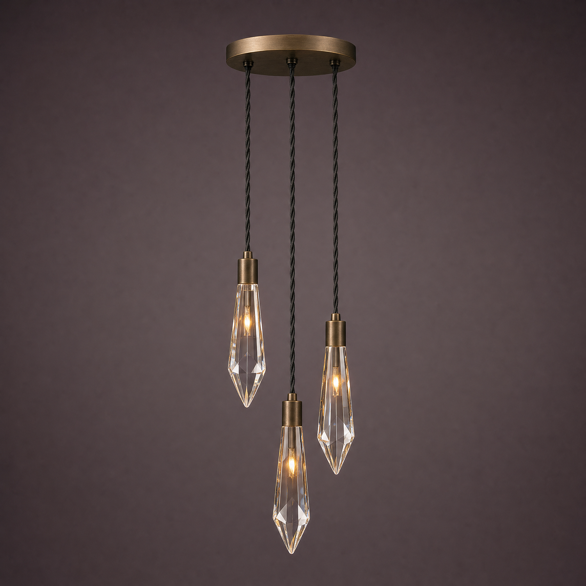 Three crystal drops at staggered heights from a round bronze spreader plate