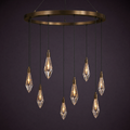 Eight crystal drops hanging from a broad bronze ring