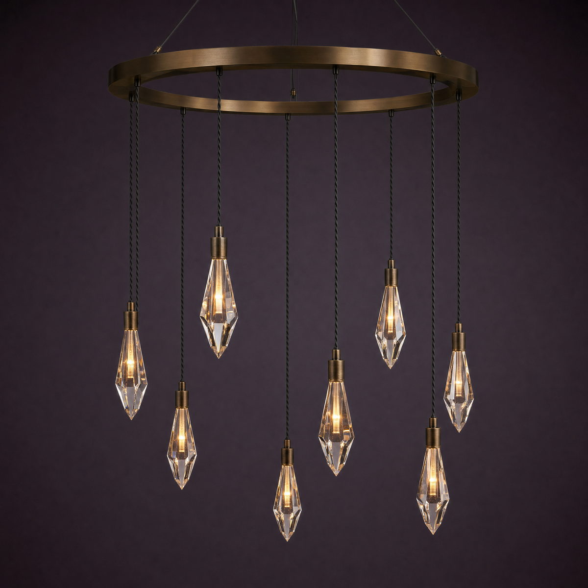 Eight crystal drops hanging from a broad bronze ring