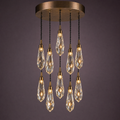 Ten crystal drops in a circular cascade from a round bronze canopy