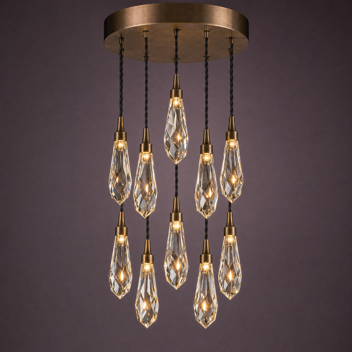 Ten crystal drops in a circular cascade from a round bronze canopy