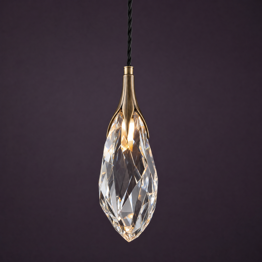 Large elongated hand-cut crystal pendant in an antique-bronze collar, lit
