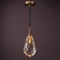 Single hand-cut crystal pendant in an antique-bronze collar, lit
